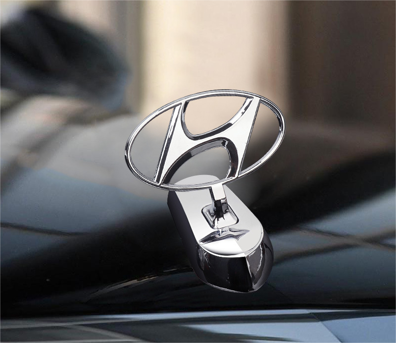 Motorhuvsemblem med billogo